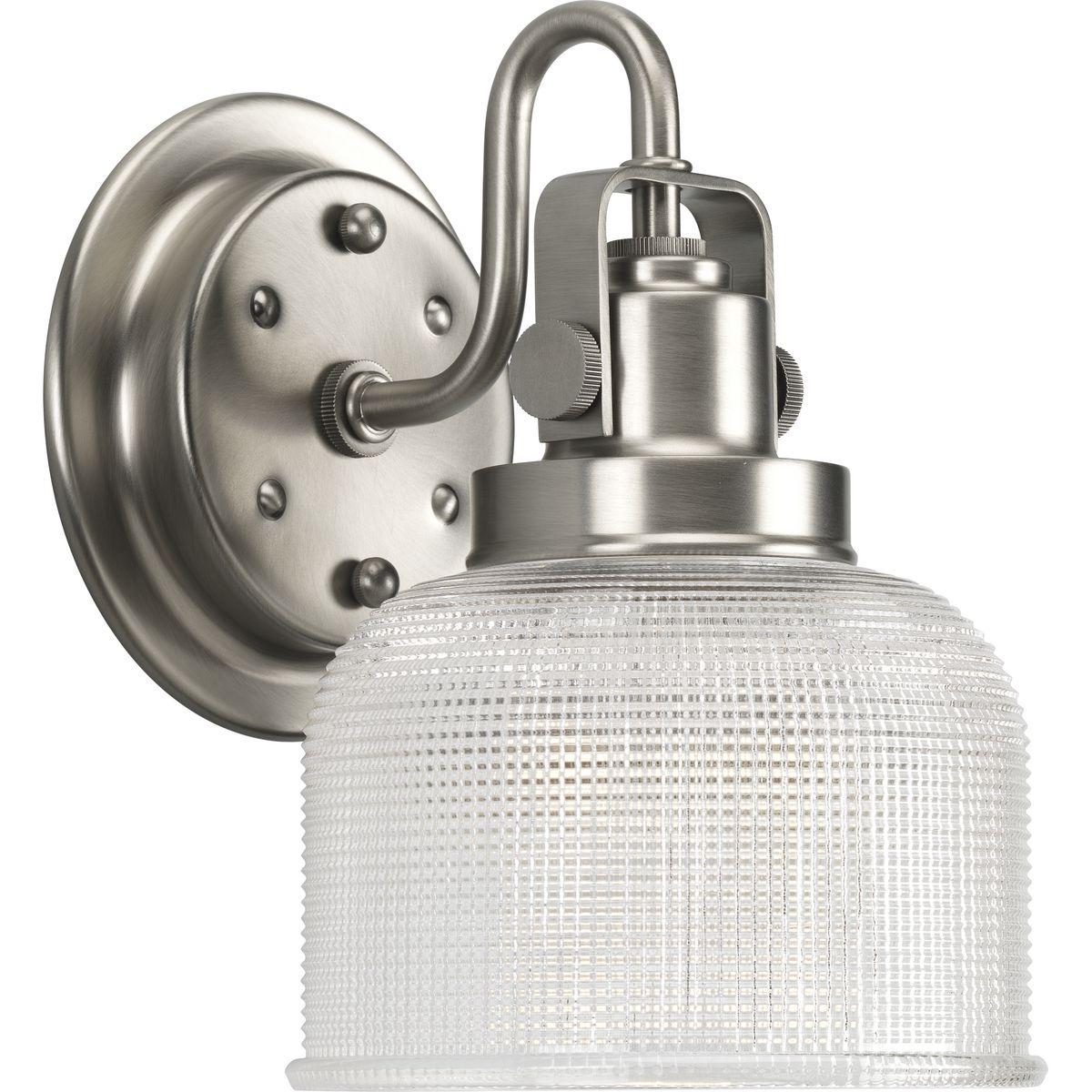 Hubbell P2989-81 Archie is a standout in any room and provides a fun and fashionable way to light your home. The authentic, prismatic style glass shade diffuses light to provide functional and stylish illumination. Finely crafted strap and knob details are conveyed by the