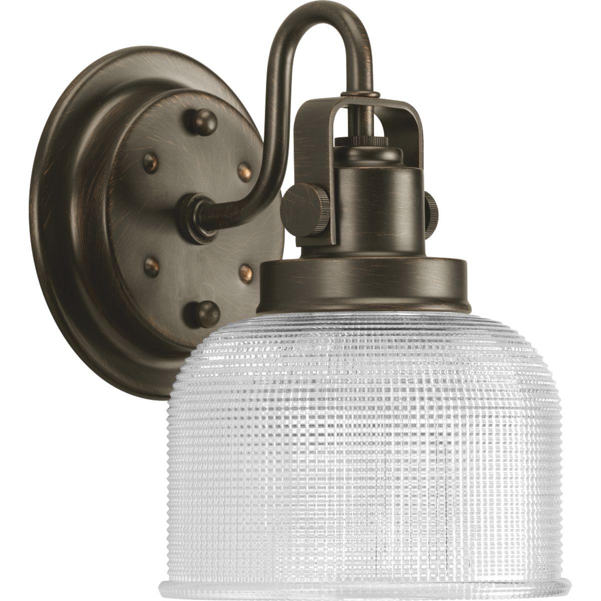 Hubbell P2989-74 Archie is a standout in any room and provides a fun and fashionable way to light your home. The authentic, prismatic style glass shade diffuses light to provide functional and stylish illumination. Finely crafted strap and knob details are conveyed by the