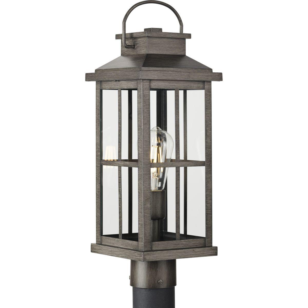 Hubbell P540095-103 Bring timeless details into a fresh silhouette with the Williamston Collection 1-Light Antique Pewter Clear Glass Farmhouse Outdoor Post Lantern Light. The frame's two-over-two grille design reminiscent of a traditional casement window frame is coated in 