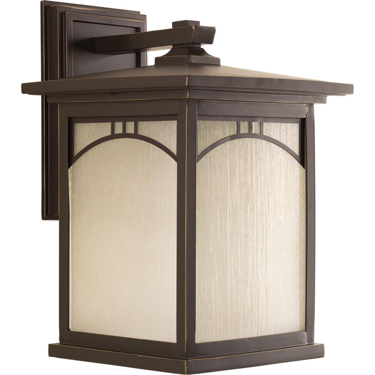 Hubbell P6054-20 Outdoor one-light large wall lantern with geometric details, umber textured art glass, and an Antique Bronze finish.  ; Antique bronze finish. ; Umber textured art glass panels. ; Geometric details.