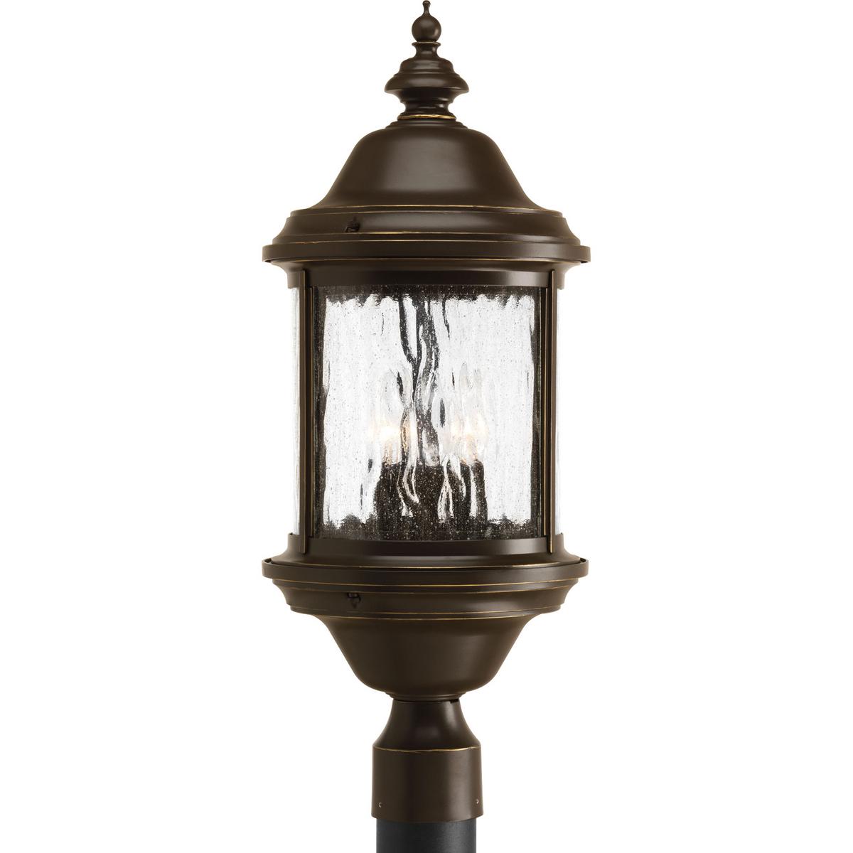Hubbell P5450-20 Inspired by lanterns from the Old World, the Ashmore collection incorporates handsome details, quill-scrolled arms and decorative finials. The water seeded glass is in a die-cast aluminum frame. The three-light post lantern. Antique Bronze finish.  ; Anti
