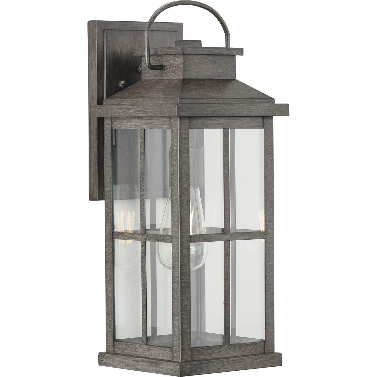 Hubbell P560266-103 Cultivate a timeless aesthetic with the Williamston Collection 1-Light Clear Glass Antique Pewter Farmhouse Large Wall Lantern Light. A light source glows from within clear glass panes beneath a traditional windowpane design for classic character. The elo