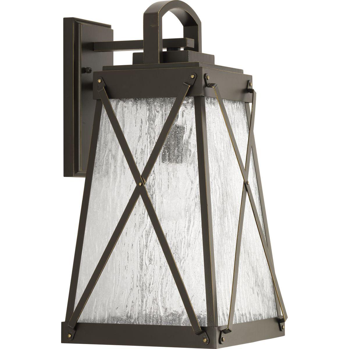 Hubbell P560033-020 A cottage-inspired outdoor large wall lantern with a tapered cage. Creighton features clear water glass clear and Antique Bronze finish. The frame's linear details are riveted to enhance mechanical detailing of the fixture. Wall, post and hanging lantern 