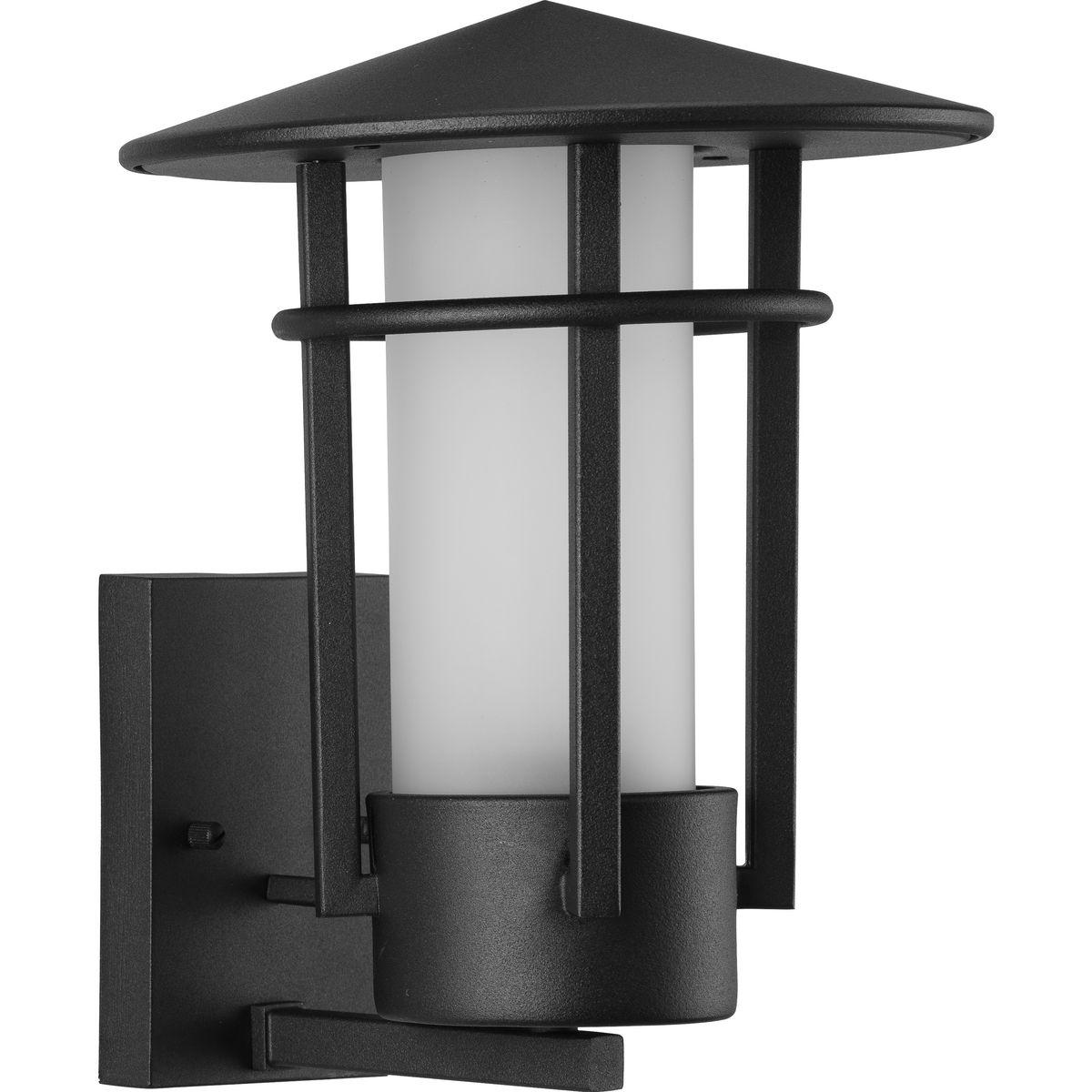 Hubbell P560273-031 Architectural influences blend harmoniously in the Exton Collection 1-Light Textured Black Etched Glass Modern Outdoor Medium Wall Lantern Light. The clean lines and geometric forms interact in the textured black frame culminating in an iconic peaked roof