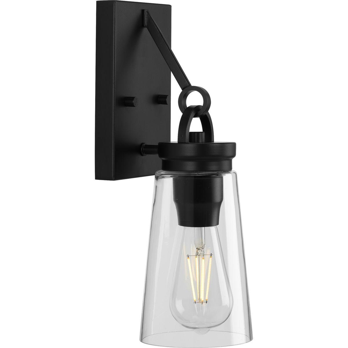 Hubbell P710097-031 Inspired by traditional post-and-beam construction, the Stockbrace Collection 1-Light Matte Black Clear Glass Farmhouse Wall Light. Clean lines, an open design, and architectural details are coated in a classic matte black finish. A light source illuminat