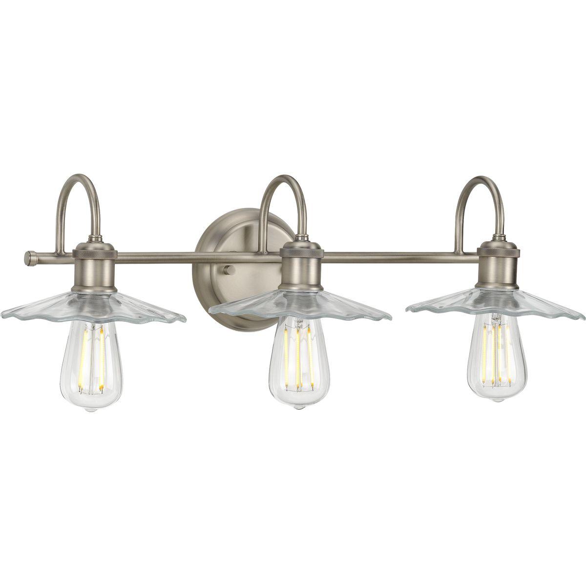 Hubbell P300288-081 Inspired from early electric lighting, this bath light will infuse your home with a sense of history. A simple antique nickel bar attached to a backplate supports curved arms bending to hold vintage-style light bases. Petal-like light shades crafted from 