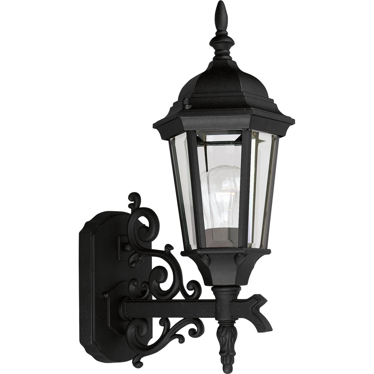 Hubbell P5681-31 The Welbourne collection features hexagonal framework with vine inspired scrolls and clear beveled glass panels. Cast aluminum construction with durable powder coat finish. One-light 6-1/2 in bottom mount outdoor wall lantern in a Black finish.  ; Hexagon